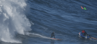 Big Wave Surfartum Row collision with Jet skiing in Nazareth in Portugal